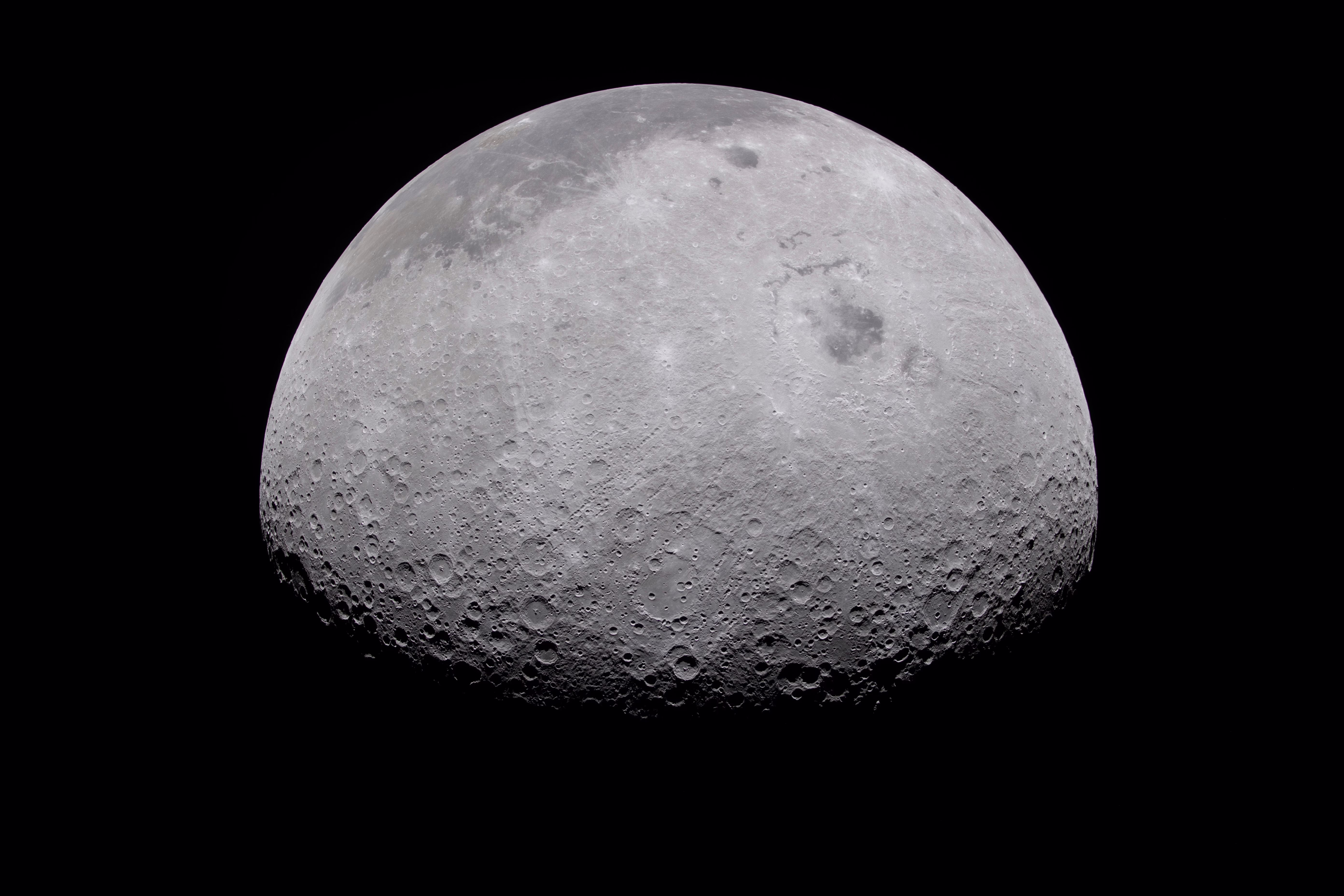A view of a mostly-full moon, seen from space