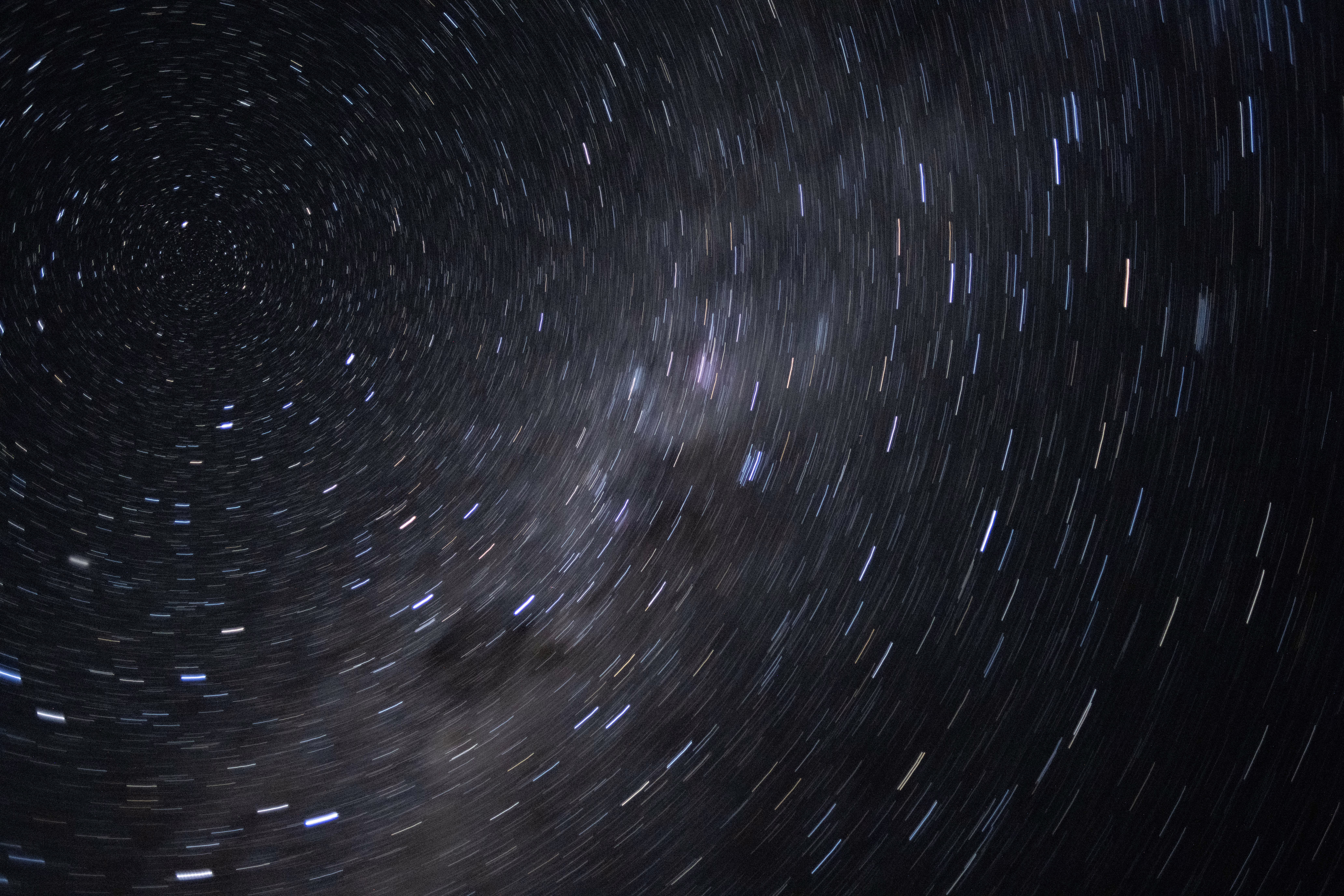 A motion-blurred view of nearby stars and the Milky Way, seen from space