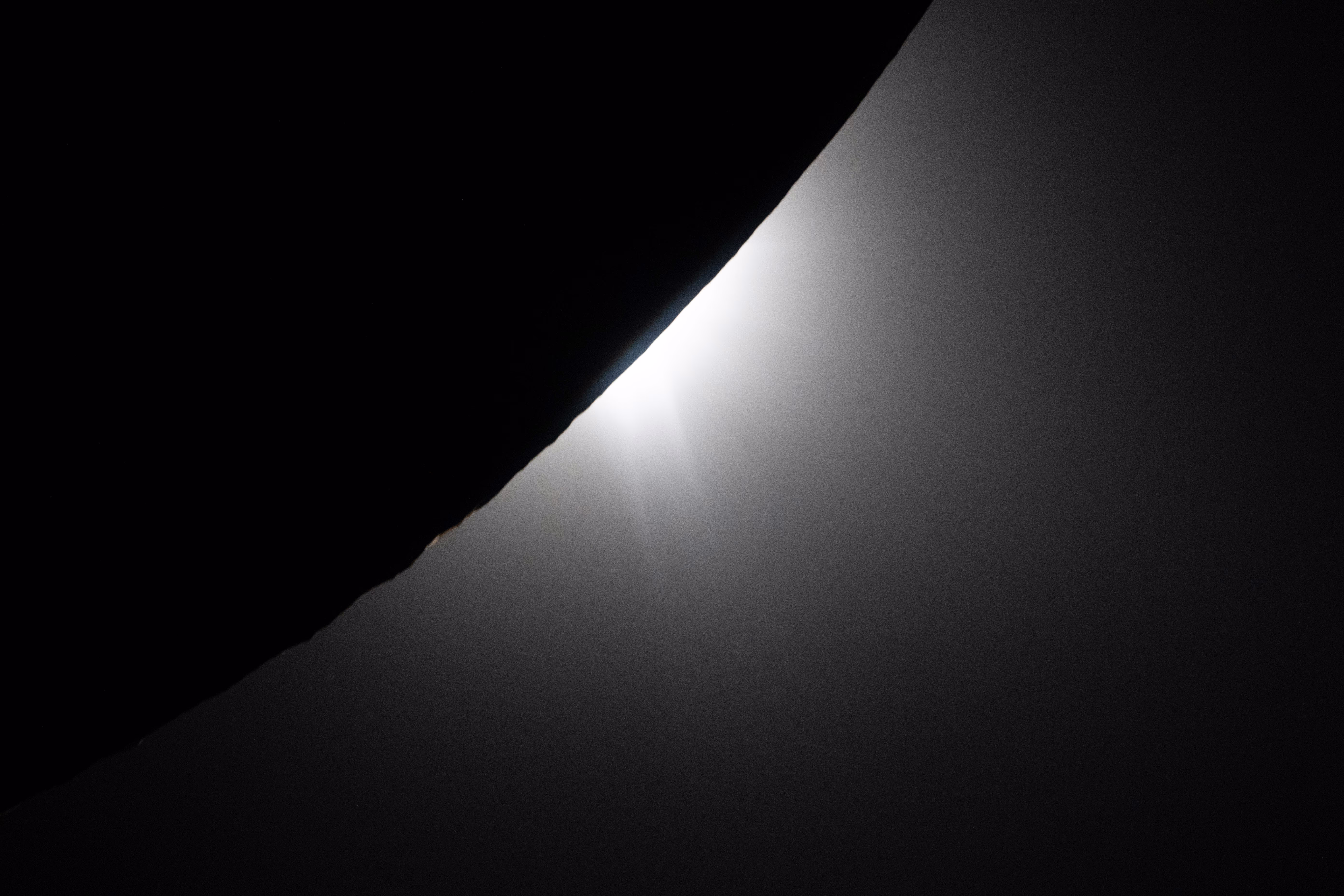 Bright rays of sunlight are visible as the moon eclipses the sun.