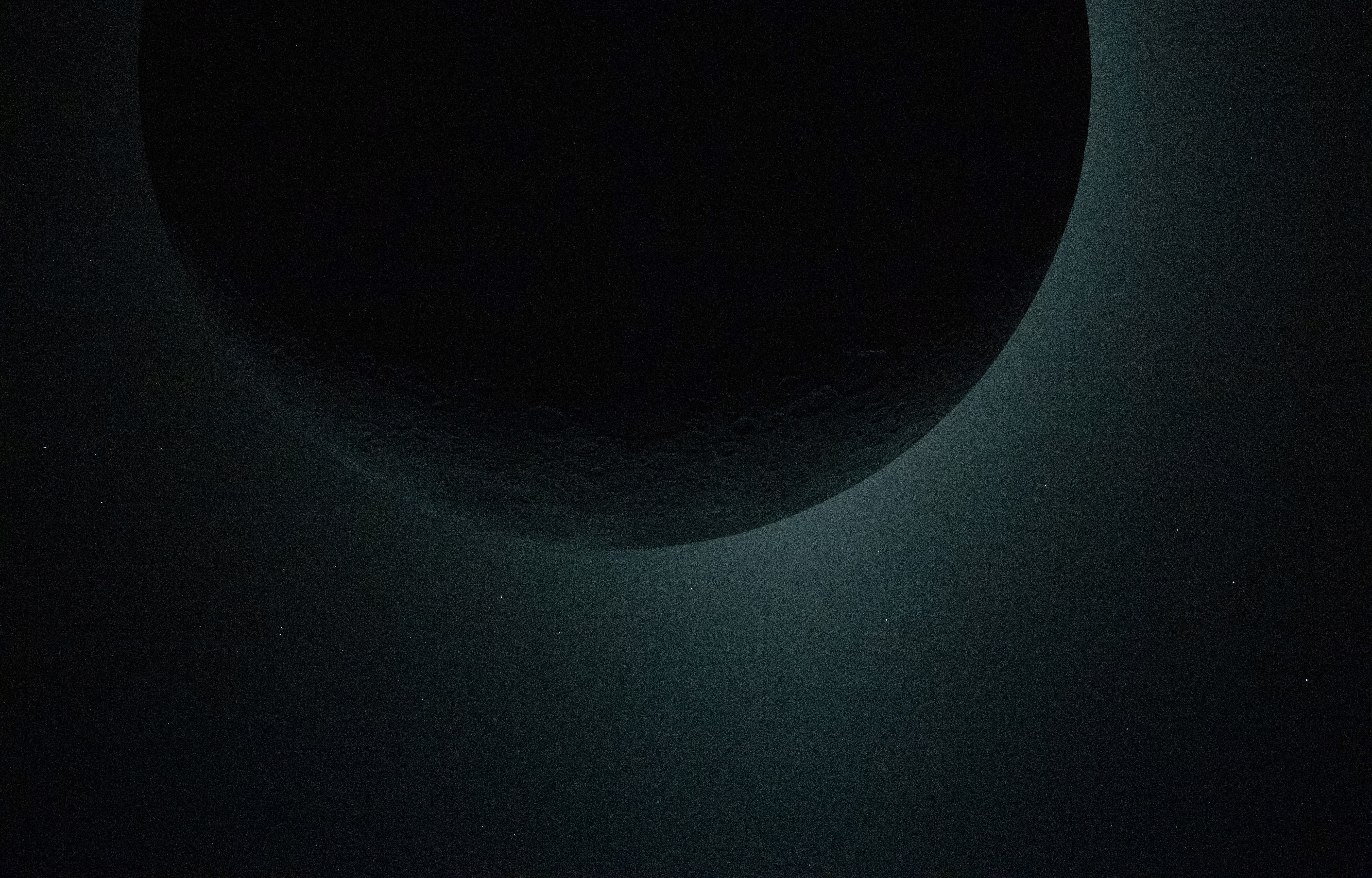 Artemis II crew members observe the moon eclipsing the sun.
