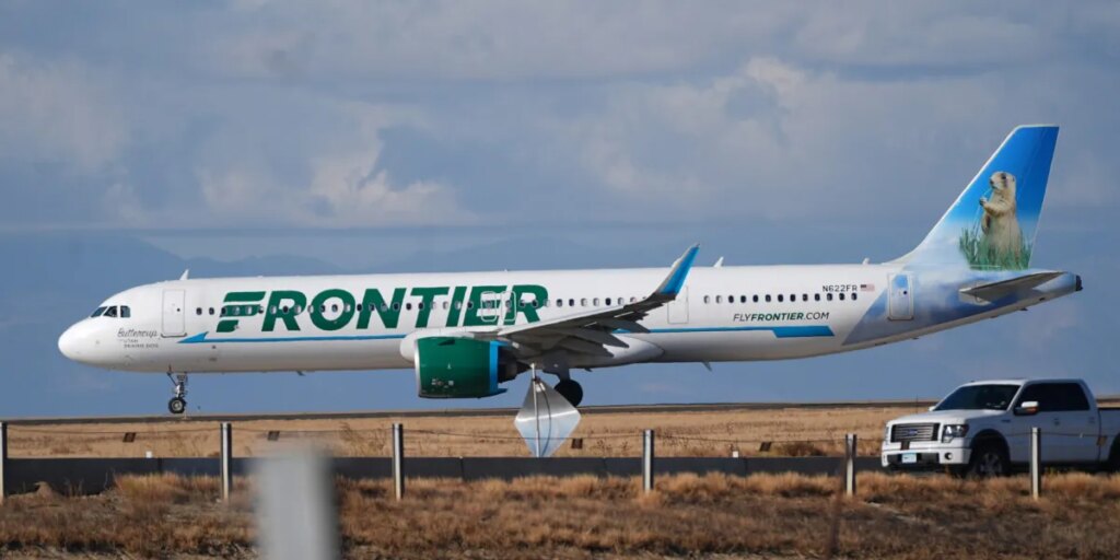Pedestrian who jumped Denver airport fence dies after being hit by Frontier Airlines plane, sparking an engine fire and forcing passengers to evacuate