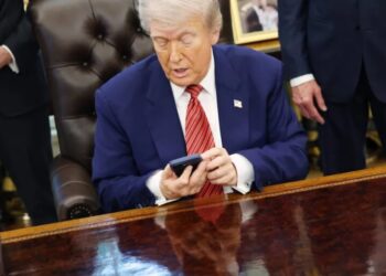 Trump Mobile quietly rewrote its fine print to say the gold Trump phone may never be made, a year after taking $100 deposits