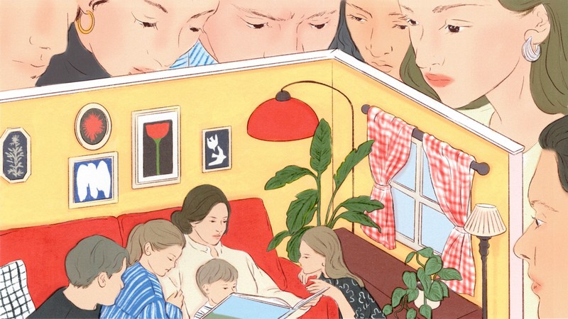 A group of people looking inside a dollhouse filled with a family