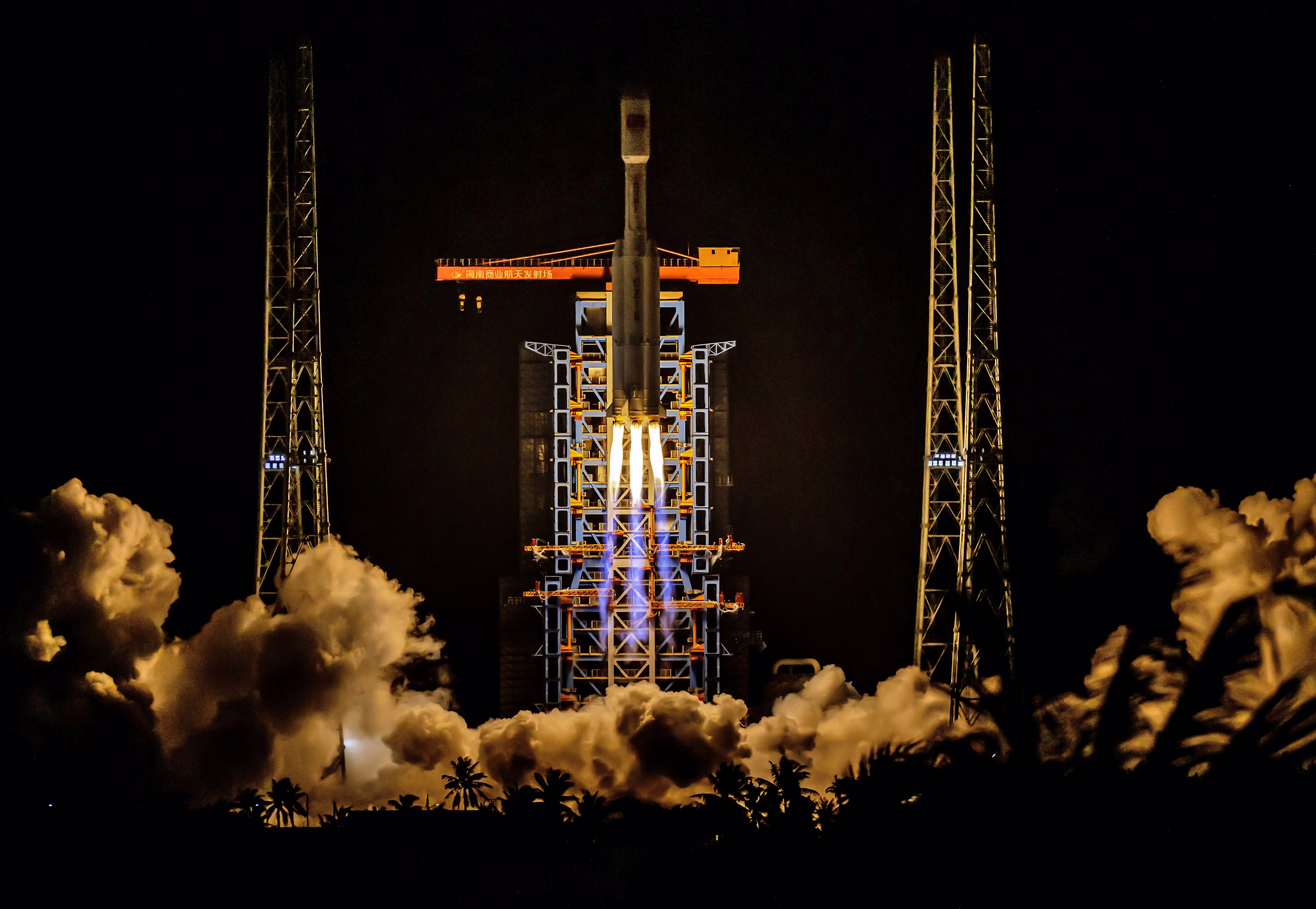 A rocket launches at night.