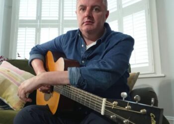 AI is splitting the music world. This 49-year-old guitarist used it to keep playing after Parkinson’s