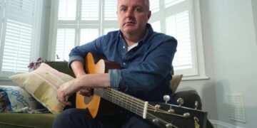 AI is splitting the music world. This 49-year-old guitarist used it to keep playing after Parkinson’s