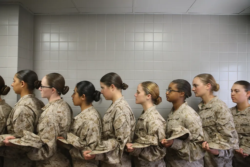 Female Marine recruits waiting in line for lunch.