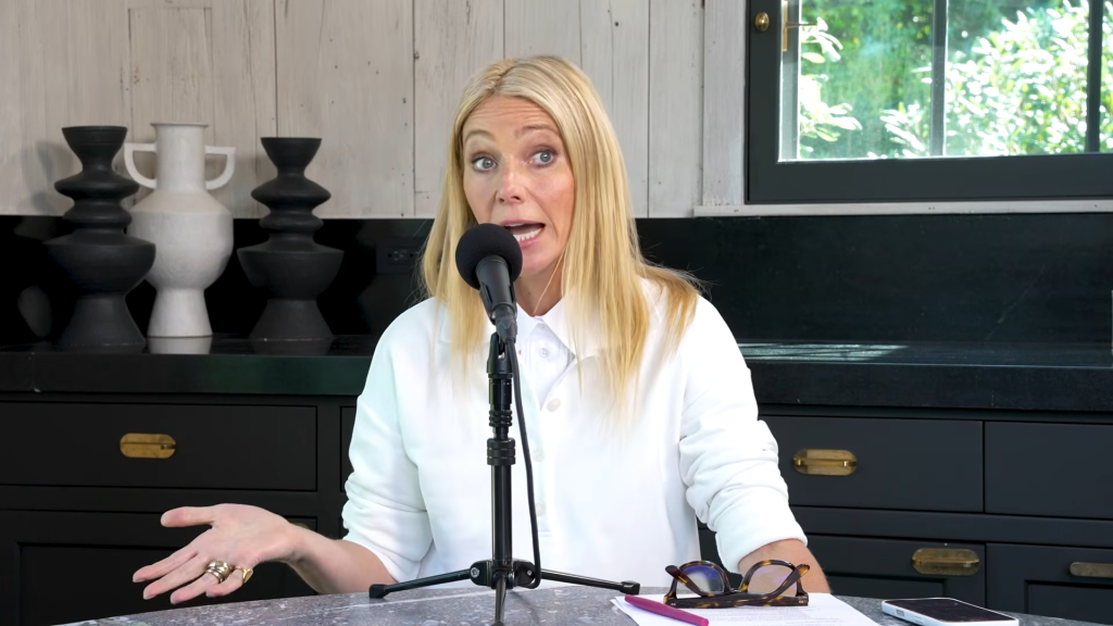 Gwyneth Paltrow speaking into a microphone.