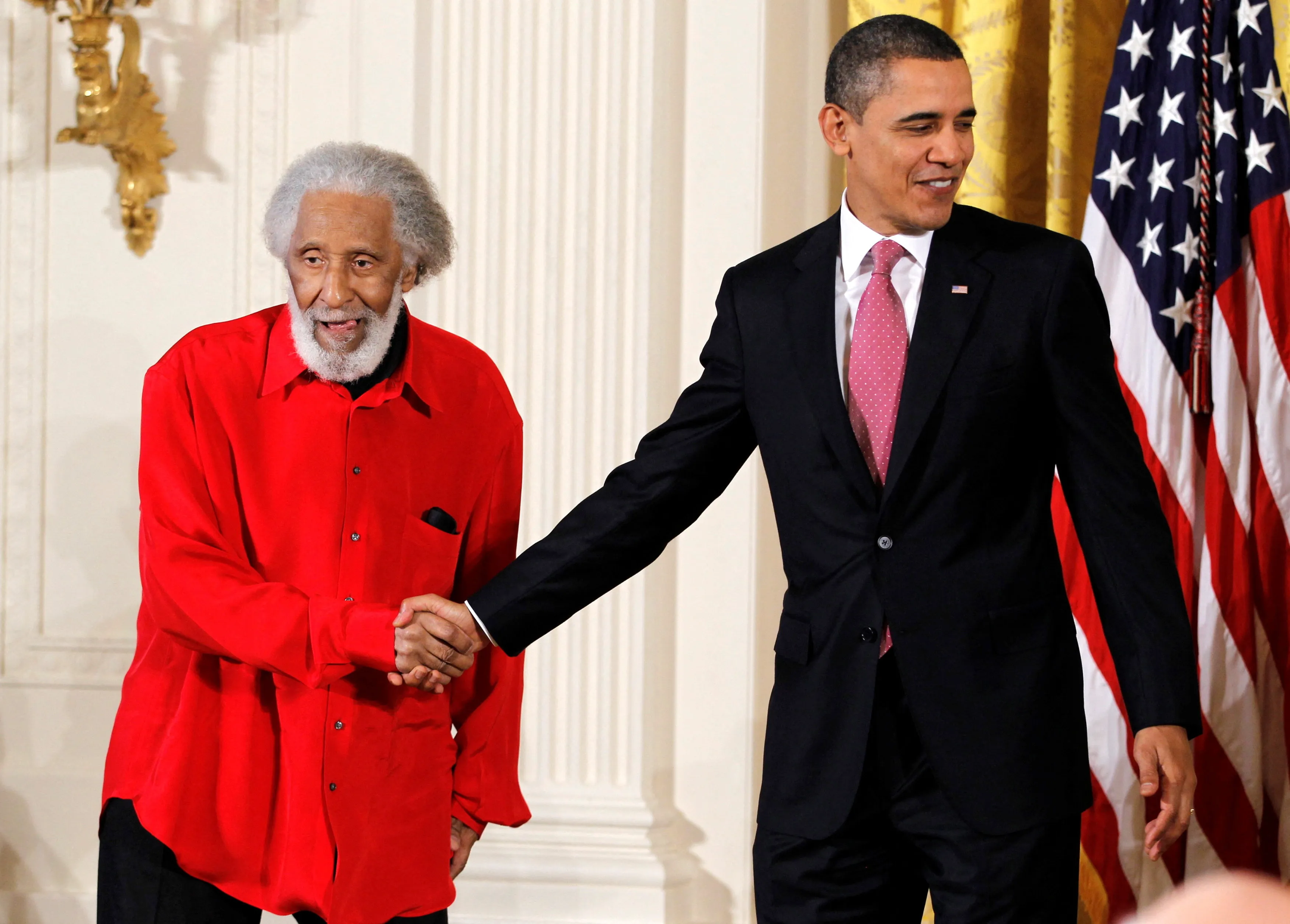 President Barack Obama shakes hands with jazz musician Sonny Rollins before presenting him with the 2010 National Medal of Arts during a ceremony in the East Room of the White House in Washington, D.C., U.S., March 2, 2011.