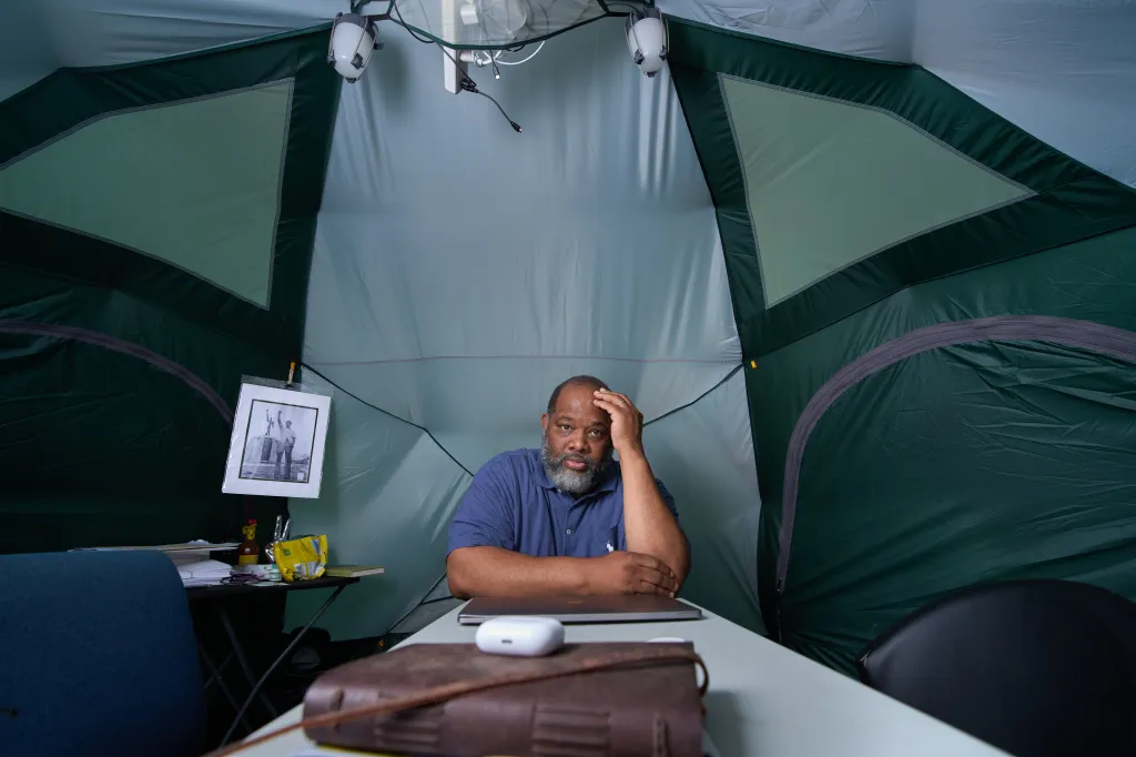 To raise awareness about the crisis in gun violence, drug and sex trafficking in his Woodlawn community, in 2011 Chicago Pastor Corey B. Brooks camped out for 94 days on the roof of a motel considered to be a source of neighborhood problems.