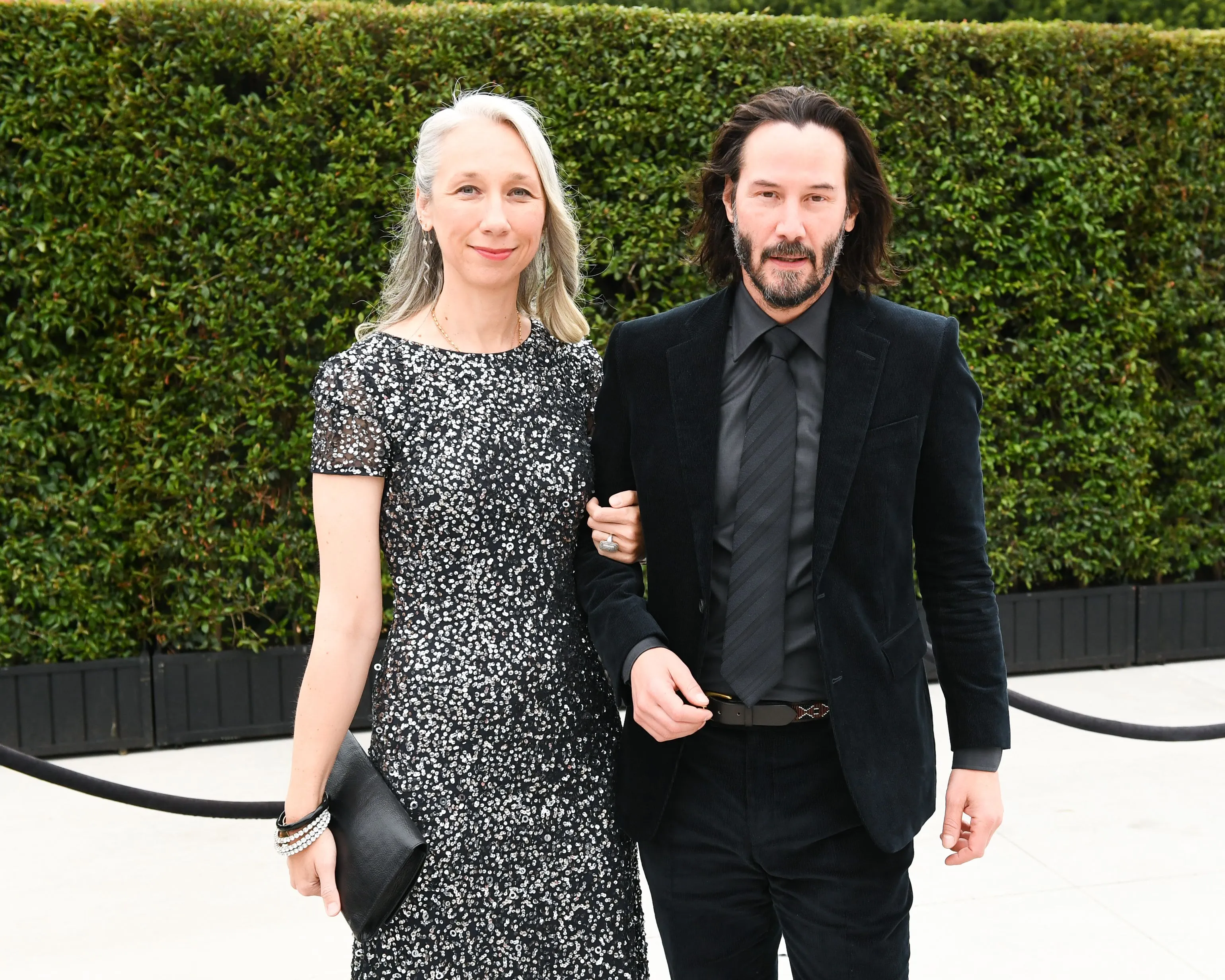 Alexandra Grant and Keanu Reeves walking arm-in-arm at MOCA Benefit in Los Angeles.