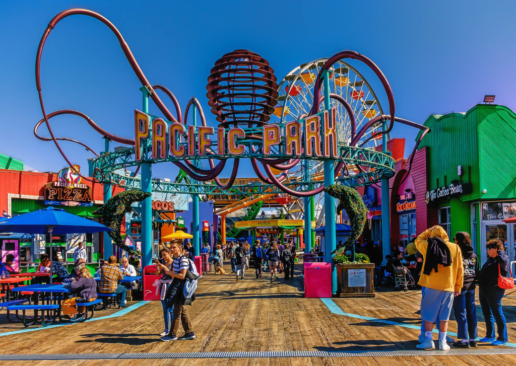 People enjoying the Pacific Park amusement attraction at Santa Monica Pier.