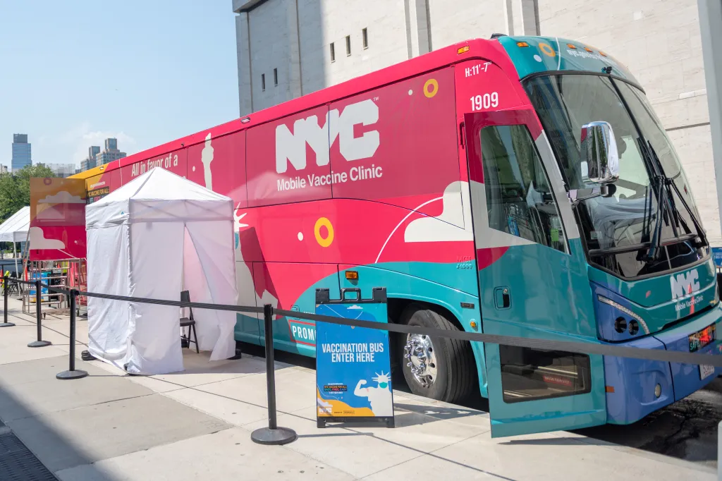 A NYC Mobile Vaccine Clinic bus parked near Lincoln Center.