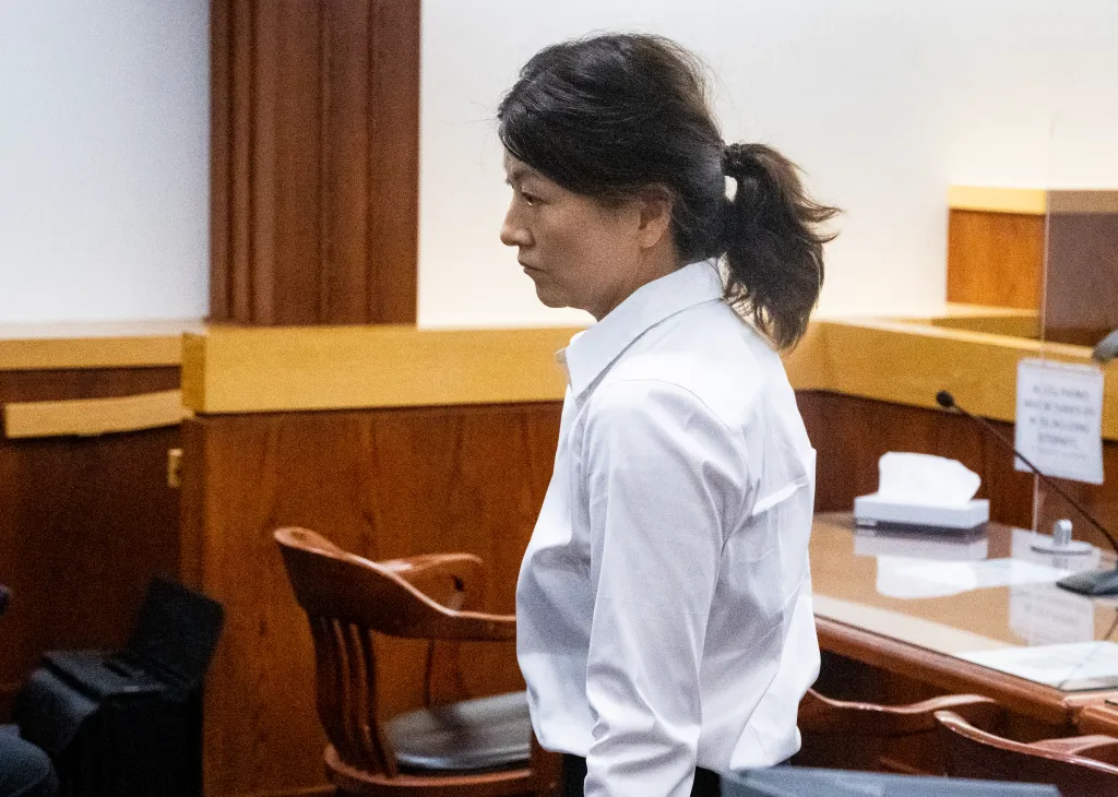 Dr. Yue Emily Yu leaves court.