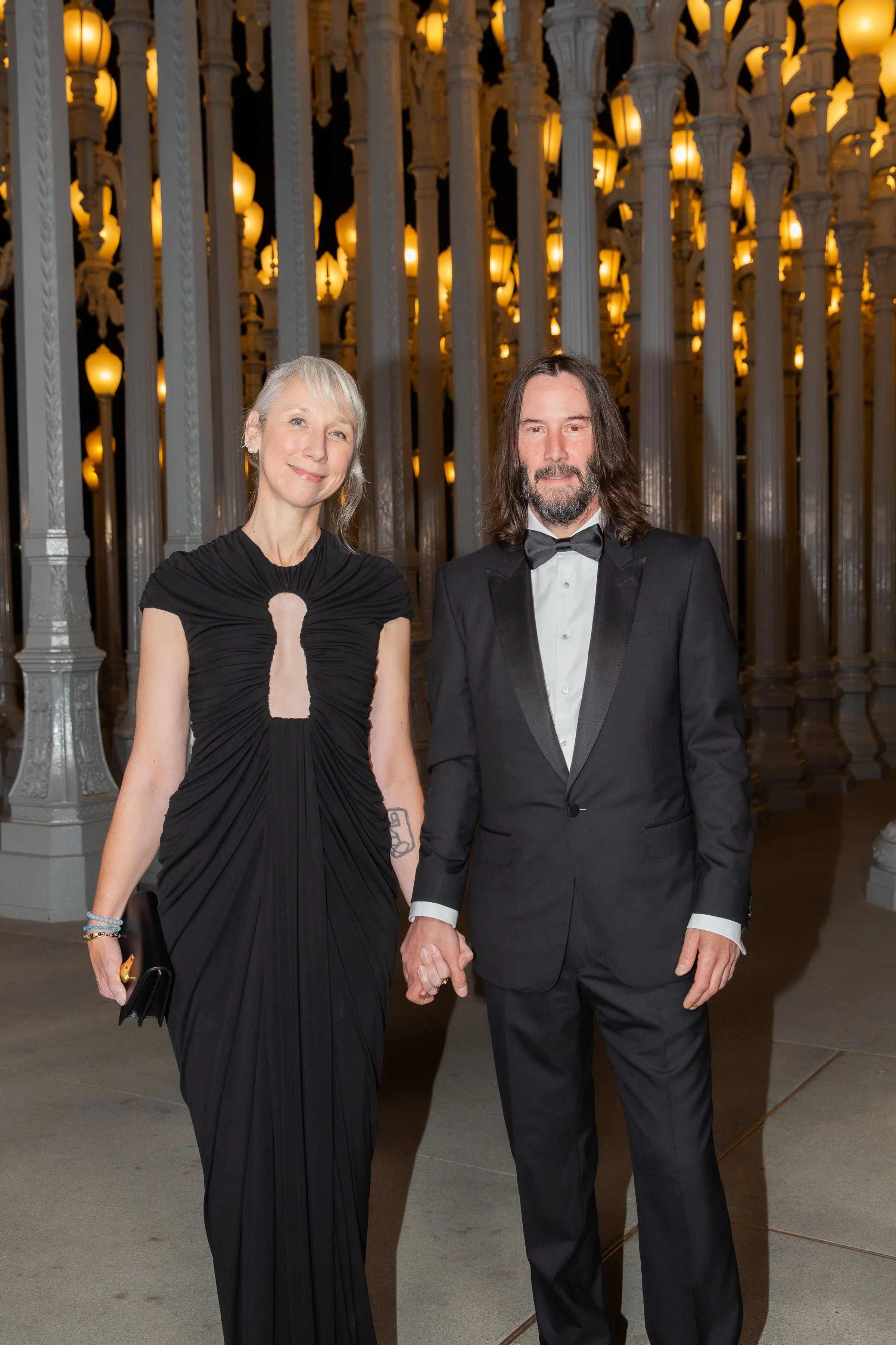 Alexandra Grant and Keanu Reeves holding hands at the LACMA Art+Film Gala.