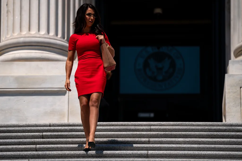Rep. Lauren Boebert walks down the steps of the House Of Representatives.