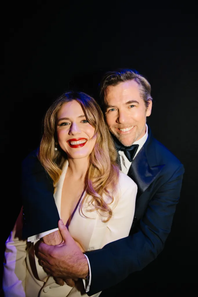 Harriet Dyer and Patrick Brammall smiling for a photo backstage at the BAFTA Television Awards.