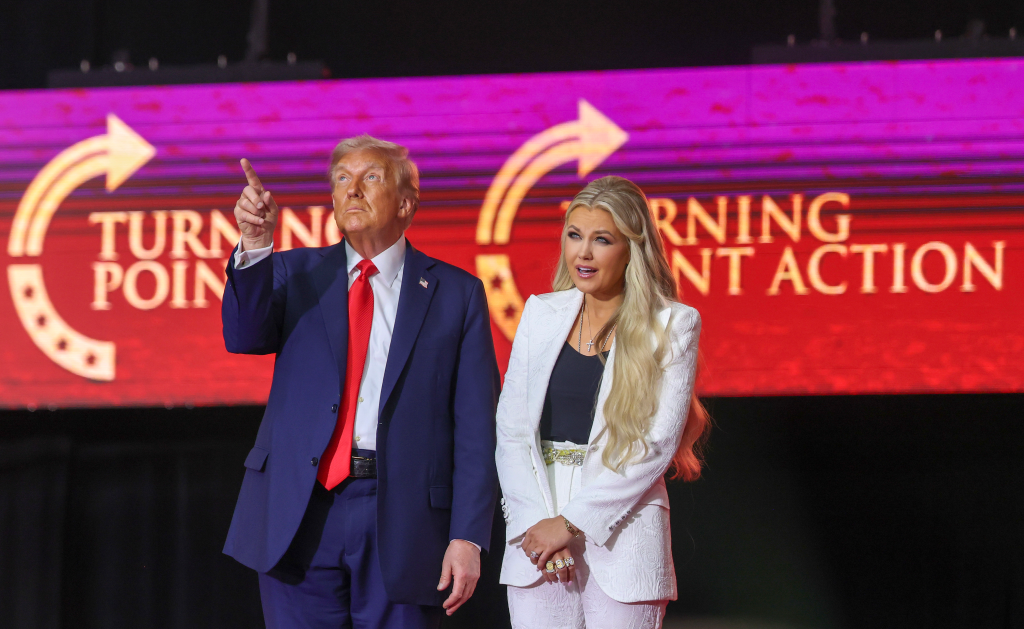 Donald Trump and Erika Kirk onstage at a memorial service, with a 