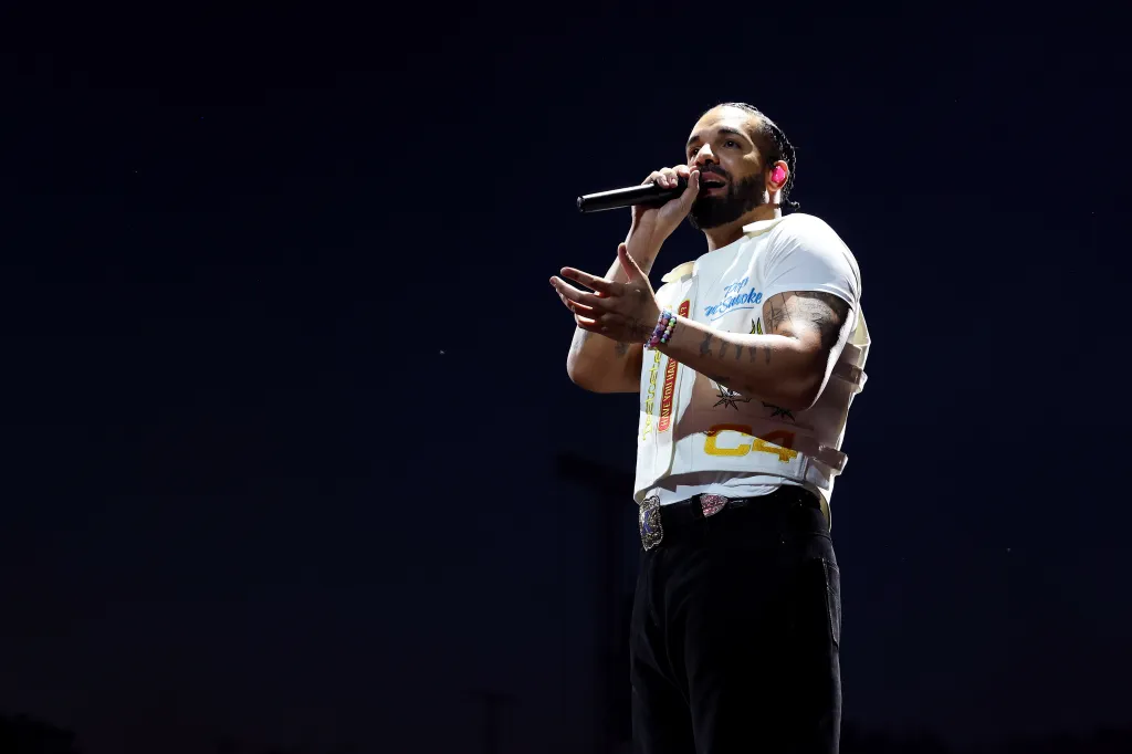 Drake performing on stage at Wireless Festival 2025.