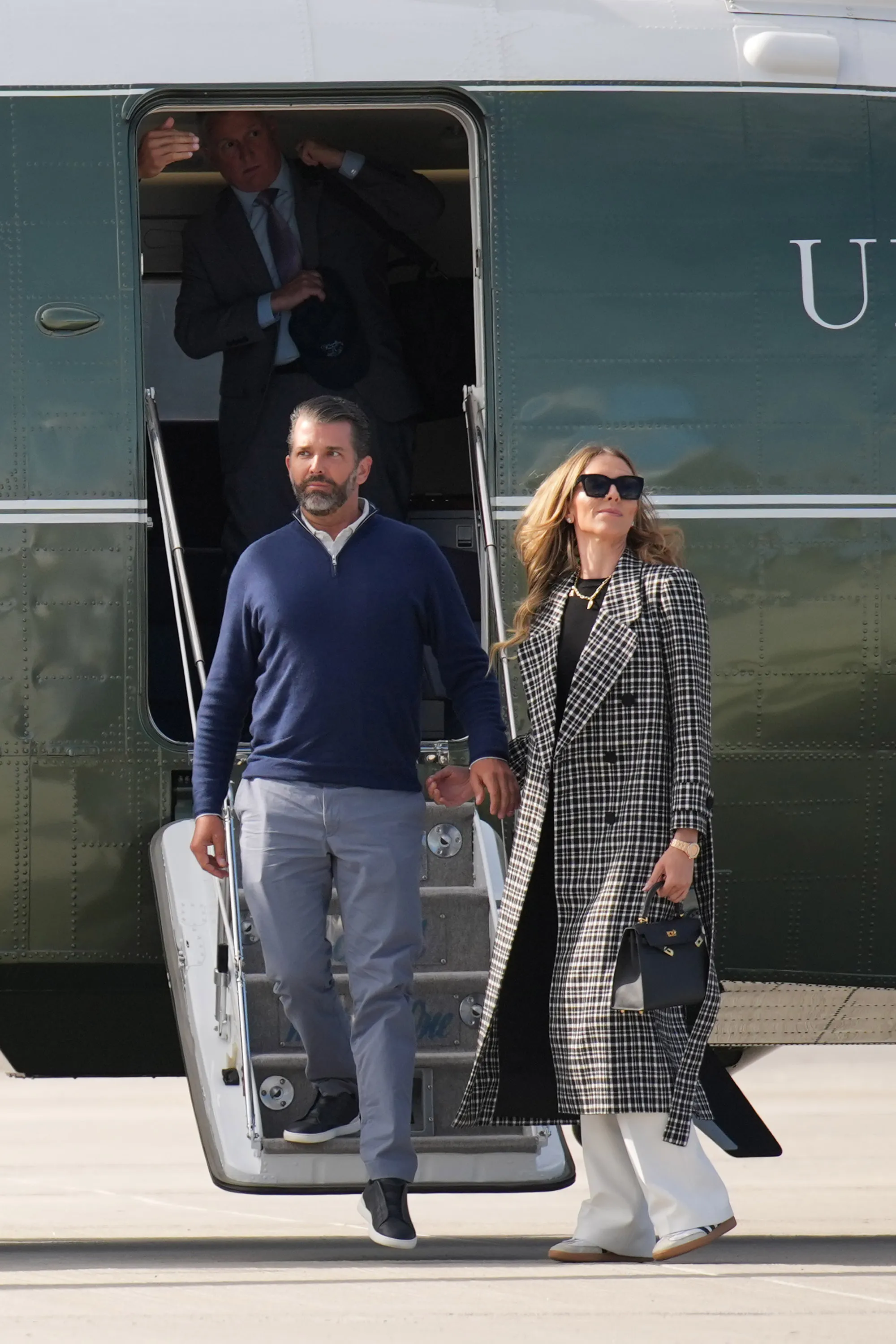 Donald Trump Jr. and Bettina Anderson disembarking a plane in Lossiemouth, Scotland.