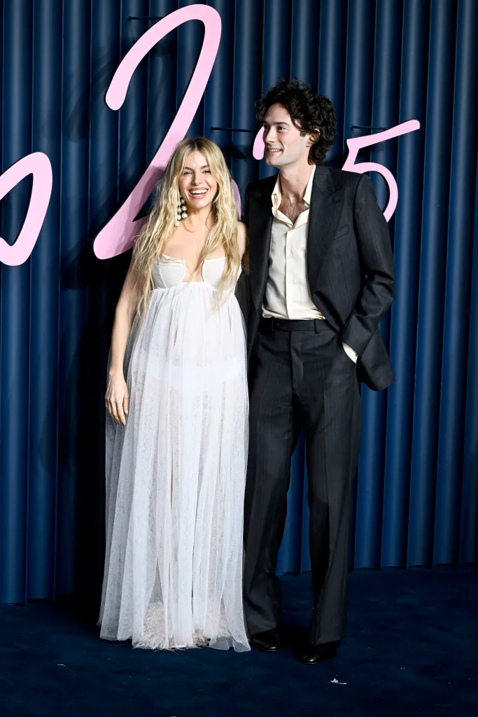 Sienna Miller and Oli Green attend The Fashion Awards 2025.