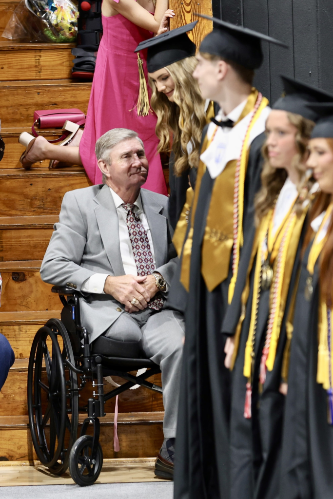 Jamie Spears in a wheelchair with his amputated leg, attending Maddie Aldridge's high school graduation.