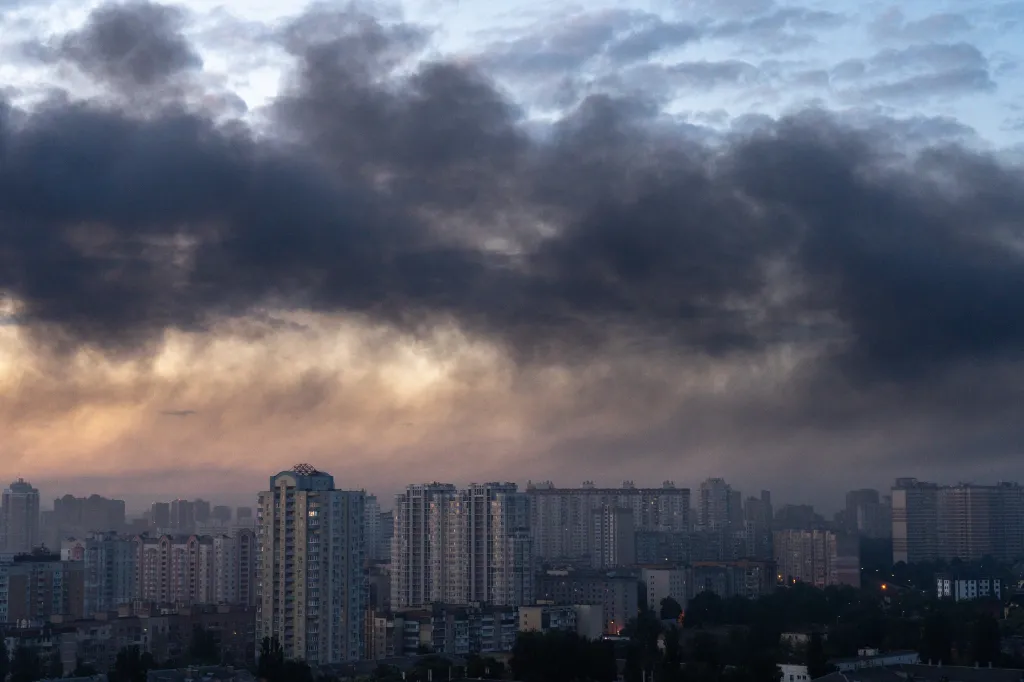 Smoke rises above Kyiv buildings during a Russian missile strike.