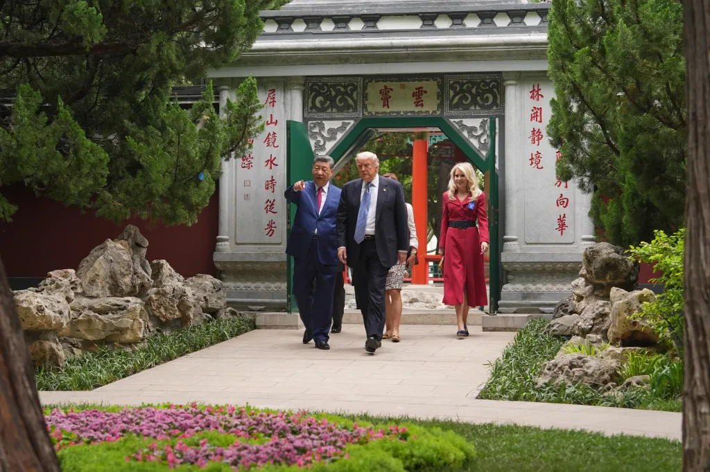 President Donald Trump and President Xi Jinping walking through the Zhongnanhai compound with a woman in a red dress.
