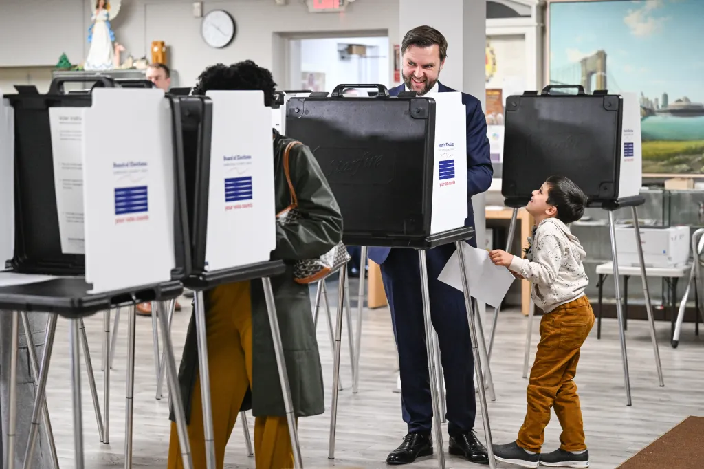 Vice President Vance votes at a polling location with his son.