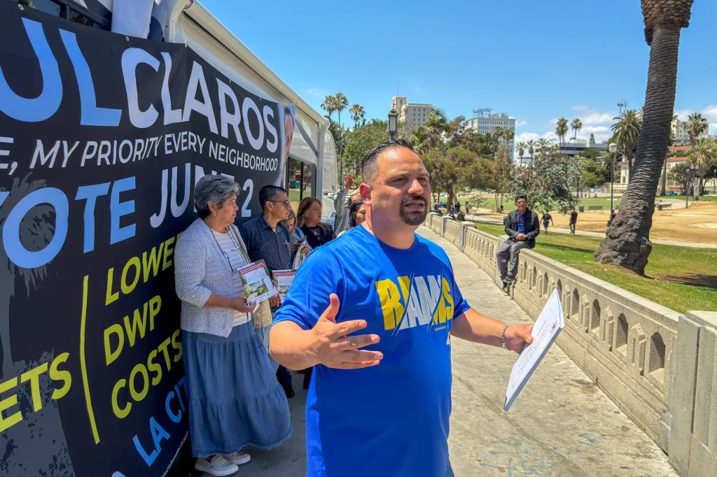 Raúl Claros speaking at a news conference in MacArthur Park.