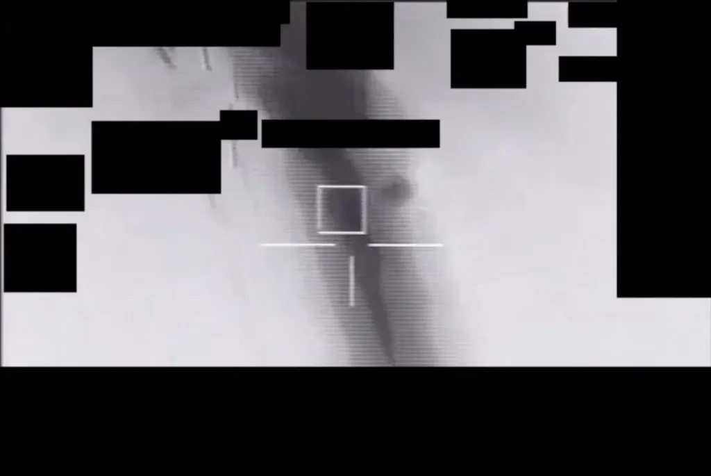 Infrared sensor footage of a UAP with a targeting reticle.