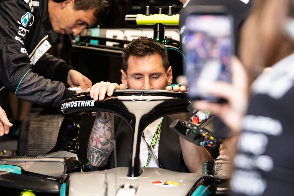 Lionel Messi in the cockpit of a Formula 1 car at the Miami International Autodrome.