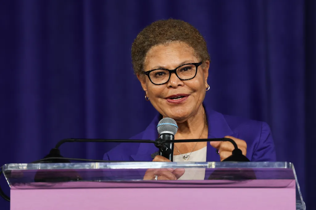 Los Angeles Mayor Karen Bass speaking at a podium with a microphone.