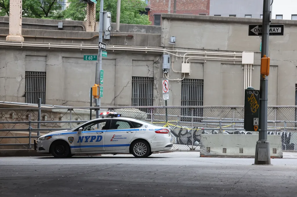 NYPD car at the closed Queensborough Bridge bike path after a fatal accident.