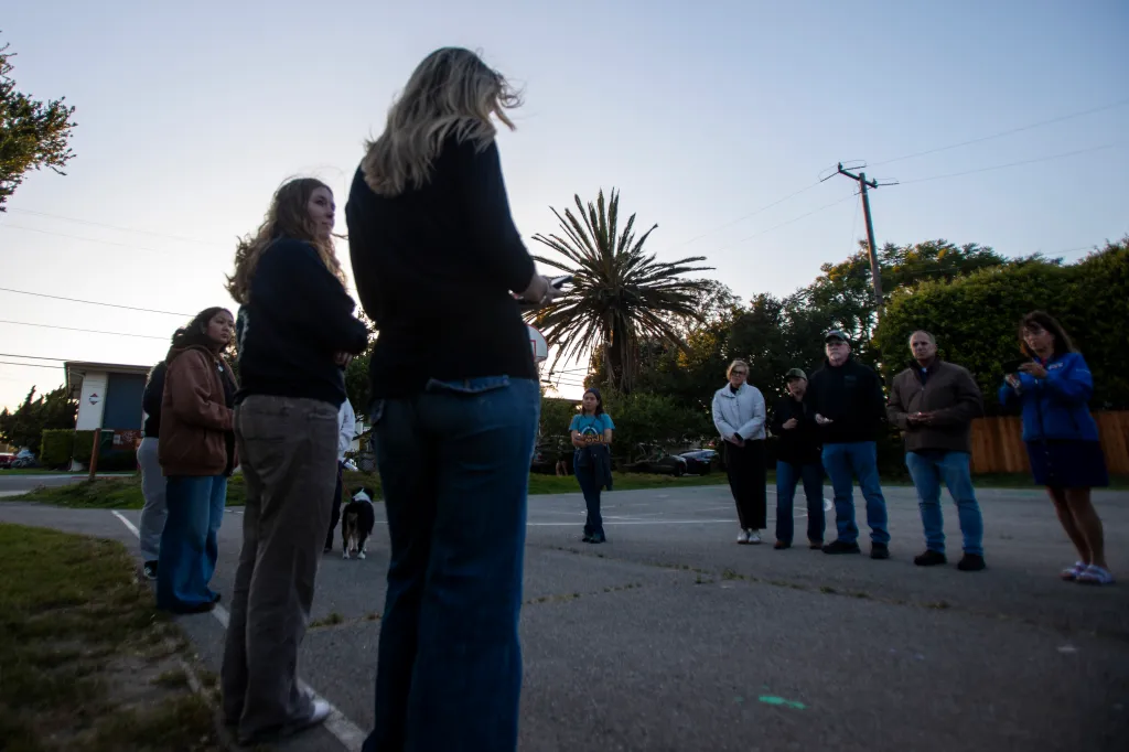 Students at a vigil honoring a survivor of a rape and strangulation assault.