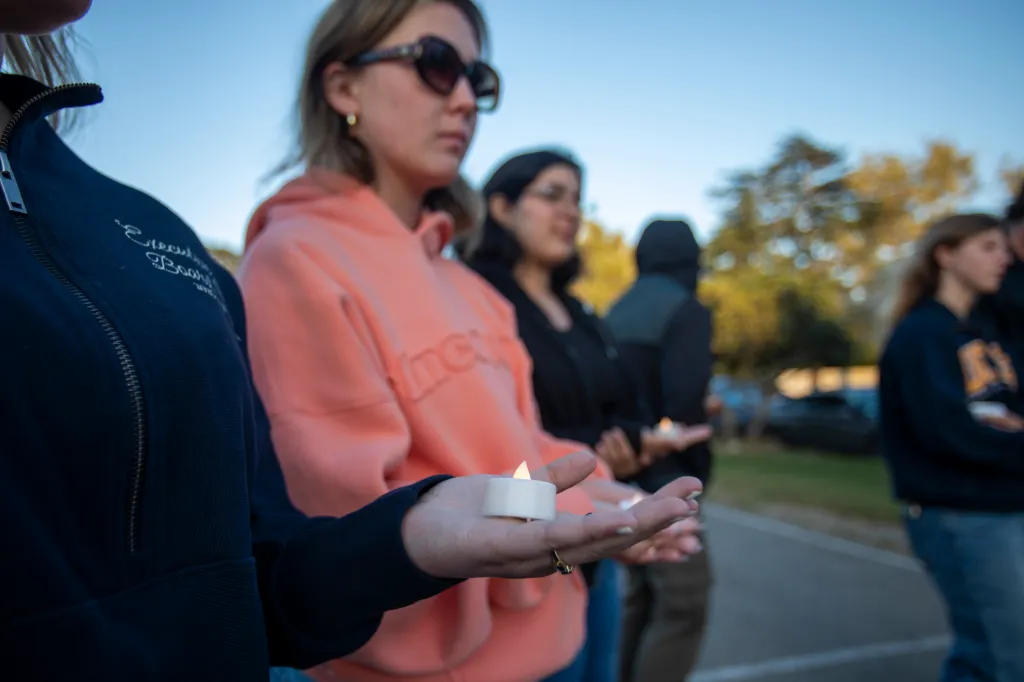 Students holding candles during a vigil at UC Santa Barbara.