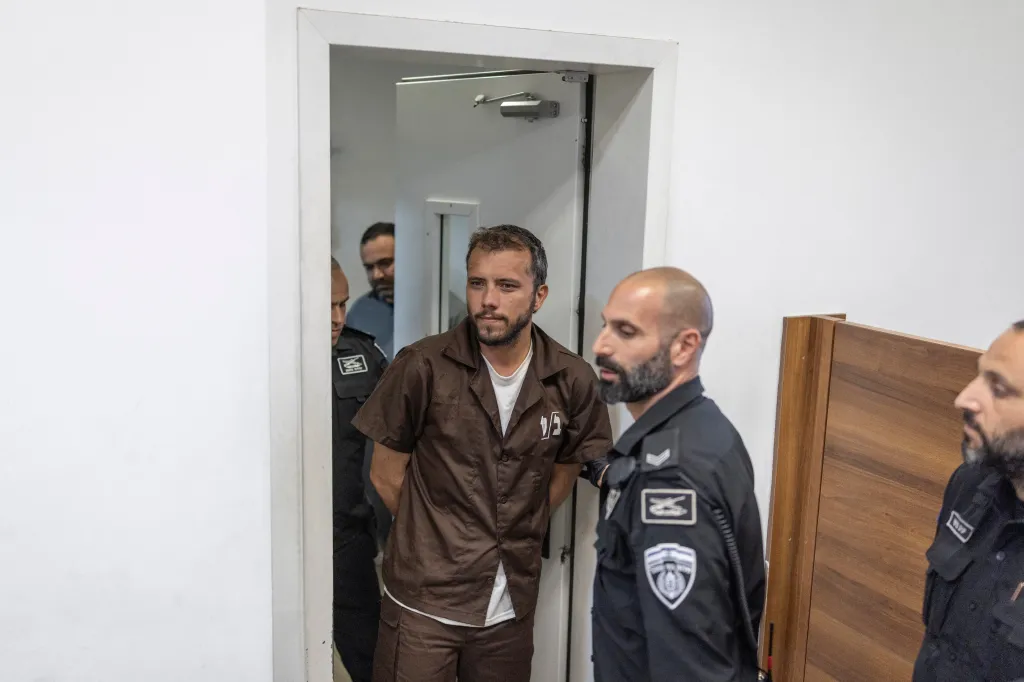 Activist Thiago Avila being escorted by Israeli authorities into court in Ashkelon.