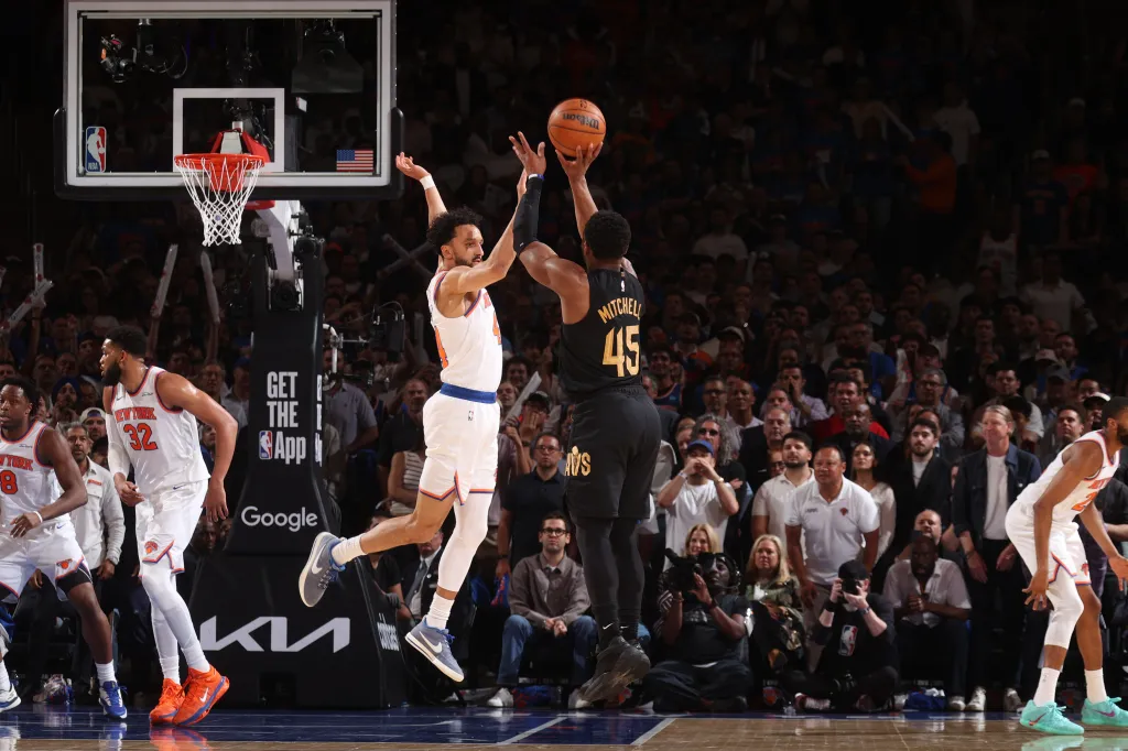 Donovan Mitchell of the Cleveland Cavaliers shoots a three-point basket against the New York Knicks.