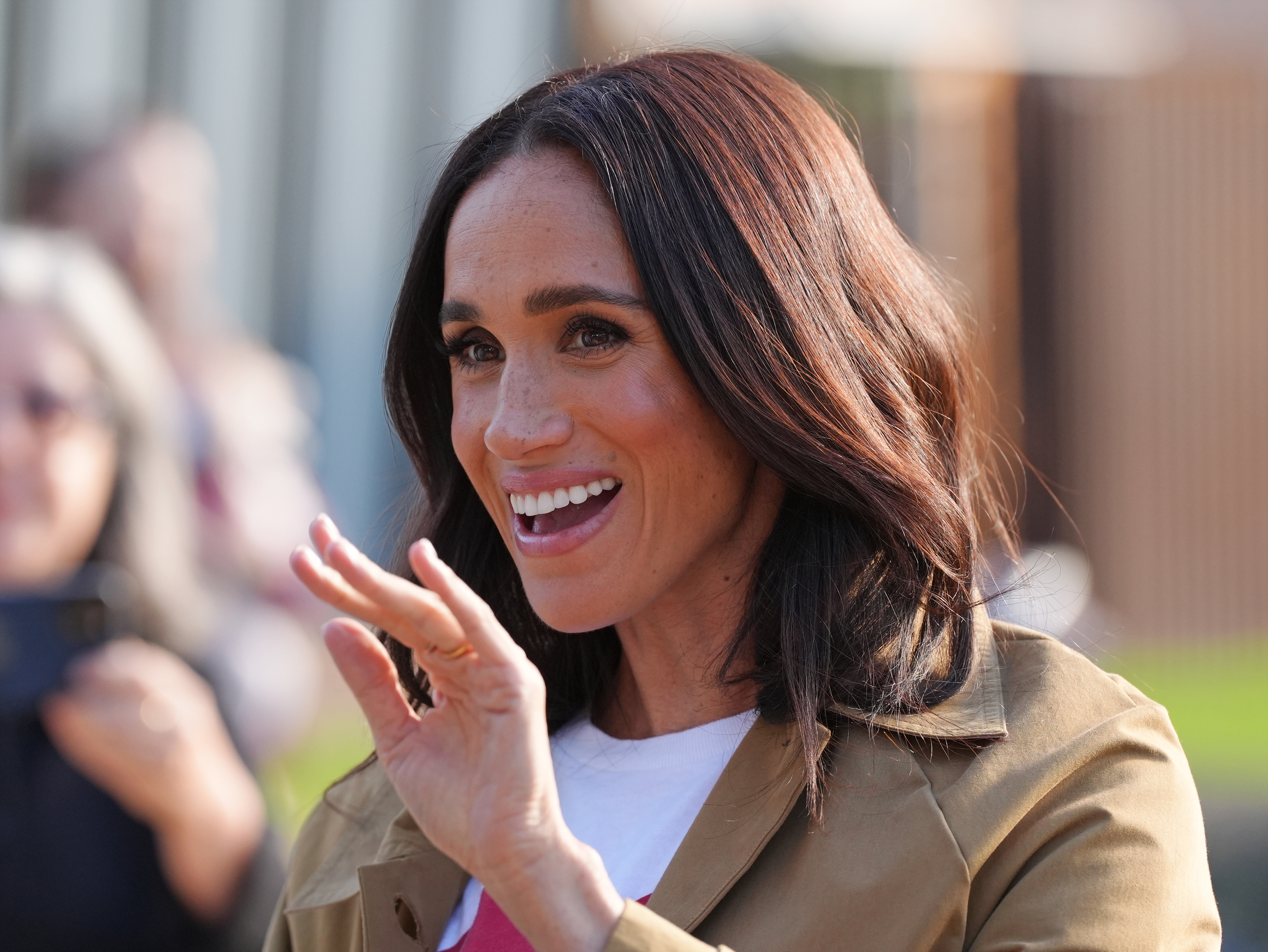 Meghan, Duchess of Sussex, smiling and waving during the Scar Tree Walk in Melbourne.