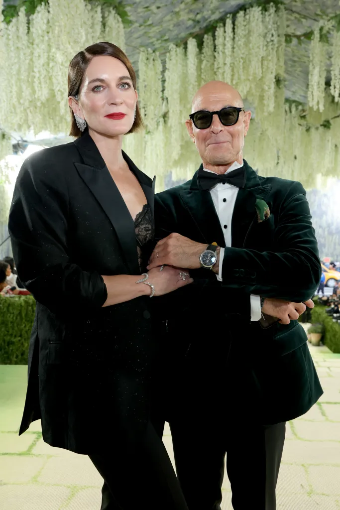 Felicity Blunt and Stanley Tucci pose on the red carpet at the Met Gala.