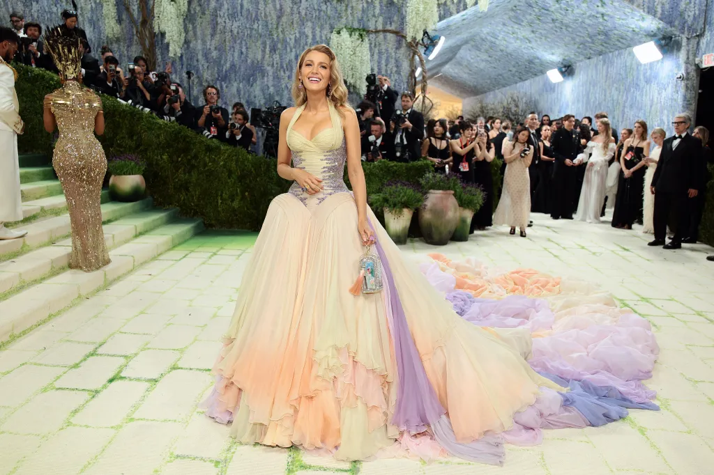 Blake Lively in a pastel-colored gown with a flowing train at the Met Gala.