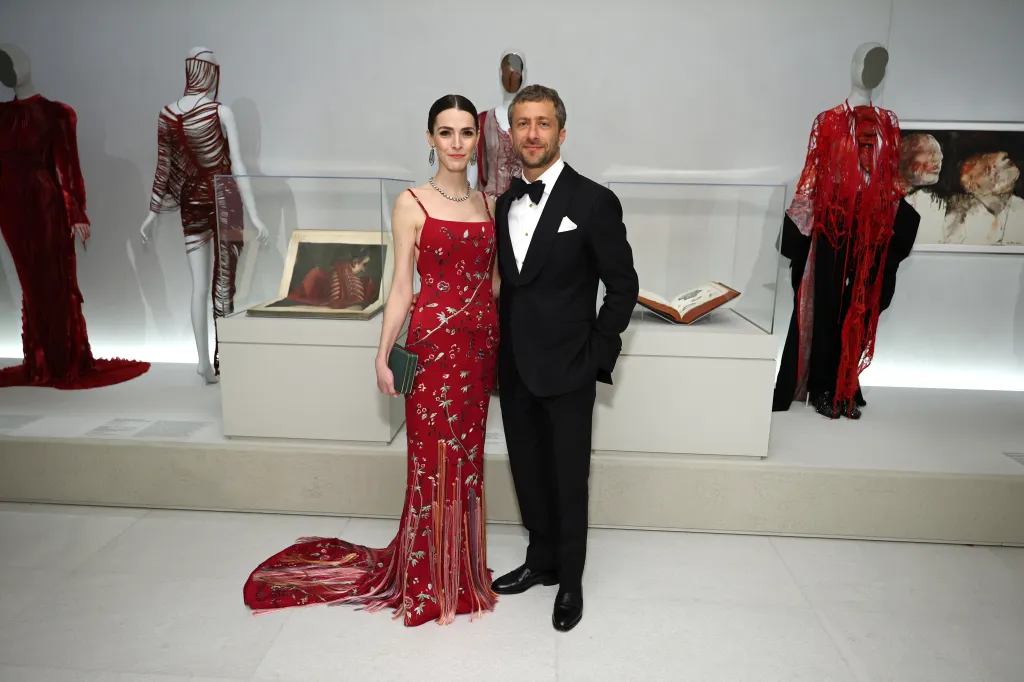 Bee Carrozzini in a red embroidered dress and Francesco Carrozzini in a black tuxedo at the 2026 Met Gala.