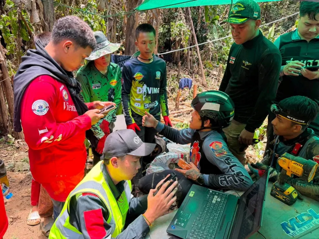 Members of a rescue team work to save seven people trapped in a cave, at a location given as Xaisomboun Province, Laos, in this handout image released May 25, 2026.
