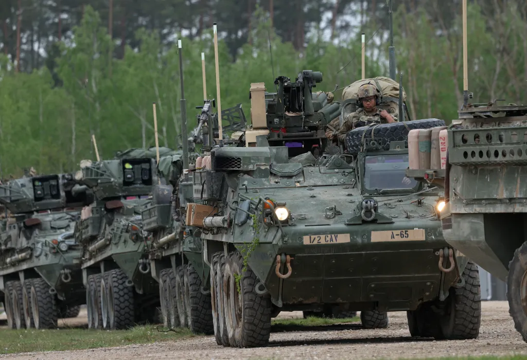 Several U.S. Army Stryker armored fighting vehicles with soldiers driving them participate in the Saber Strike 26 NATO military exercises in Bemowo Piskie, Poland.