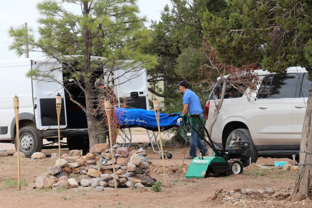 Workers remove a body recovered from the site of a suspected fentanyl exposure in Mountainair, NJ, on May 20, 2026.