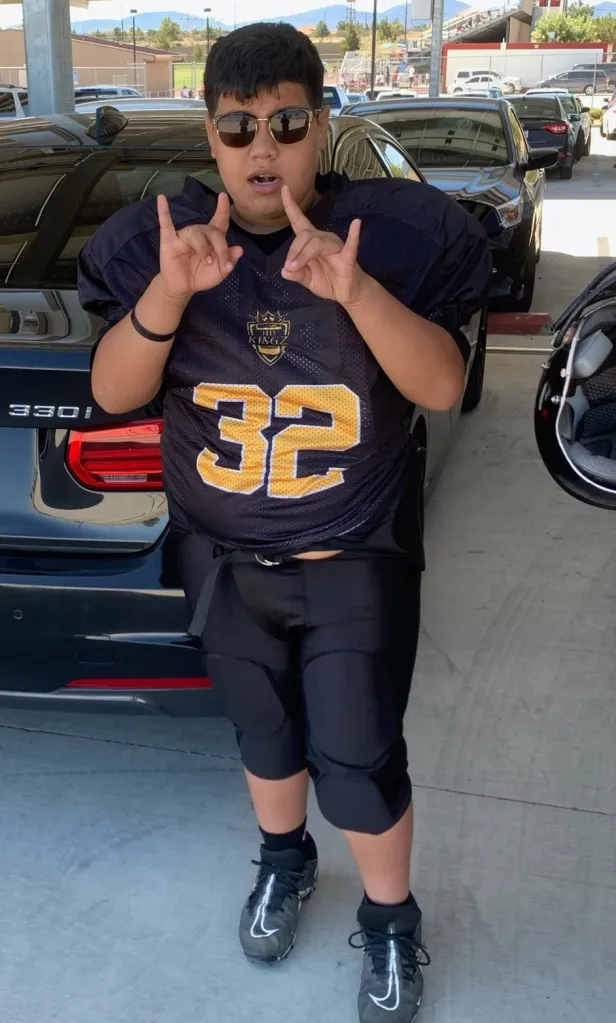 Jeremy Rosales in a football uniform, making a hand gesture.