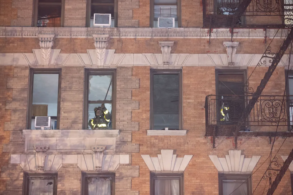 Firefighters operating inside a building during a 3-alarm fire.