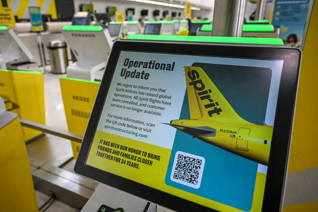 A message is displayed at a Spirit Airlines self-service check-in kiosk at Fort Lauderdale-Hollywood International Airport on May 2, 2026.