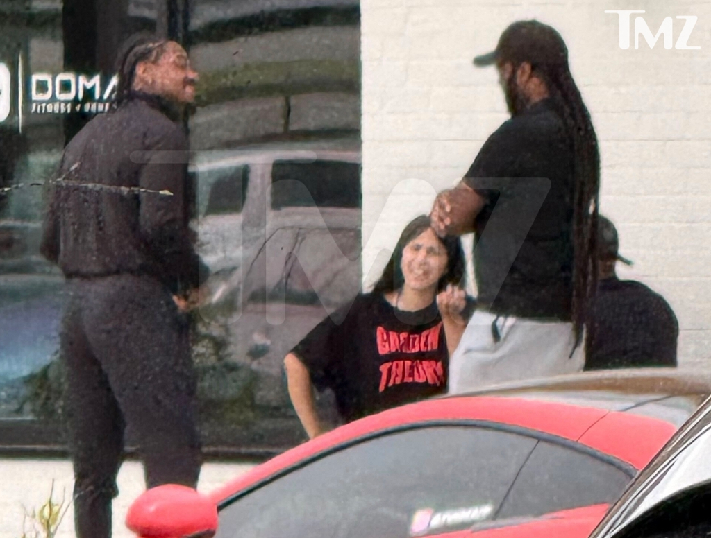 Cardi B and Stefon Diggs arguing outside a Maryland cafe.