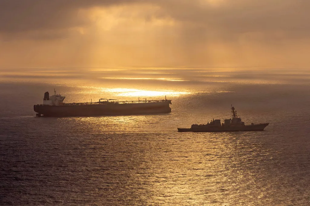 US Navy destroyer USS Rafael Peralta blocks Iranian oil tanker Herby at sea.